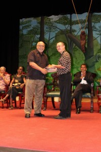 Lam collecting his prize from President Donald Ramotar