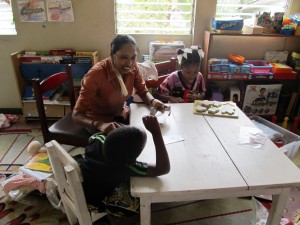 A Step by Step teacher working with her students