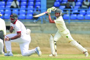 Kieron Pollard takes evasive action as Tagenarine Chanderpaul drives down the ground during the Guyana versus Trinidad and Tobago game last week