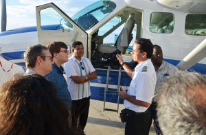BK Group of Companies Chairman Brian Tiwari and US Embassy Charge d’Affaires Bryan Hunte being told about the Cessna Grand Caravan