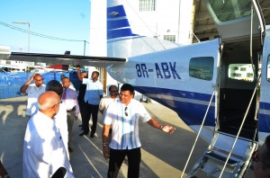 Brian Tiwari escorting President Ramotar for a tour of the Cessna Grand Caravan, recently bought by JAGS Aviation