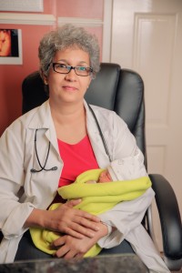 Dr Madhu Singh holds the first baby conceived and delivered using the IVF