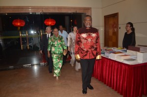 Acting President Samuel Hinds followed by Mrs Hinds, Chinese Ambassador Zhang Limin and Mrs Zhang Limin, as he attended a function at the Chinese Embassy to mark the 65th Anniversary of the founding of the People's Republic of China